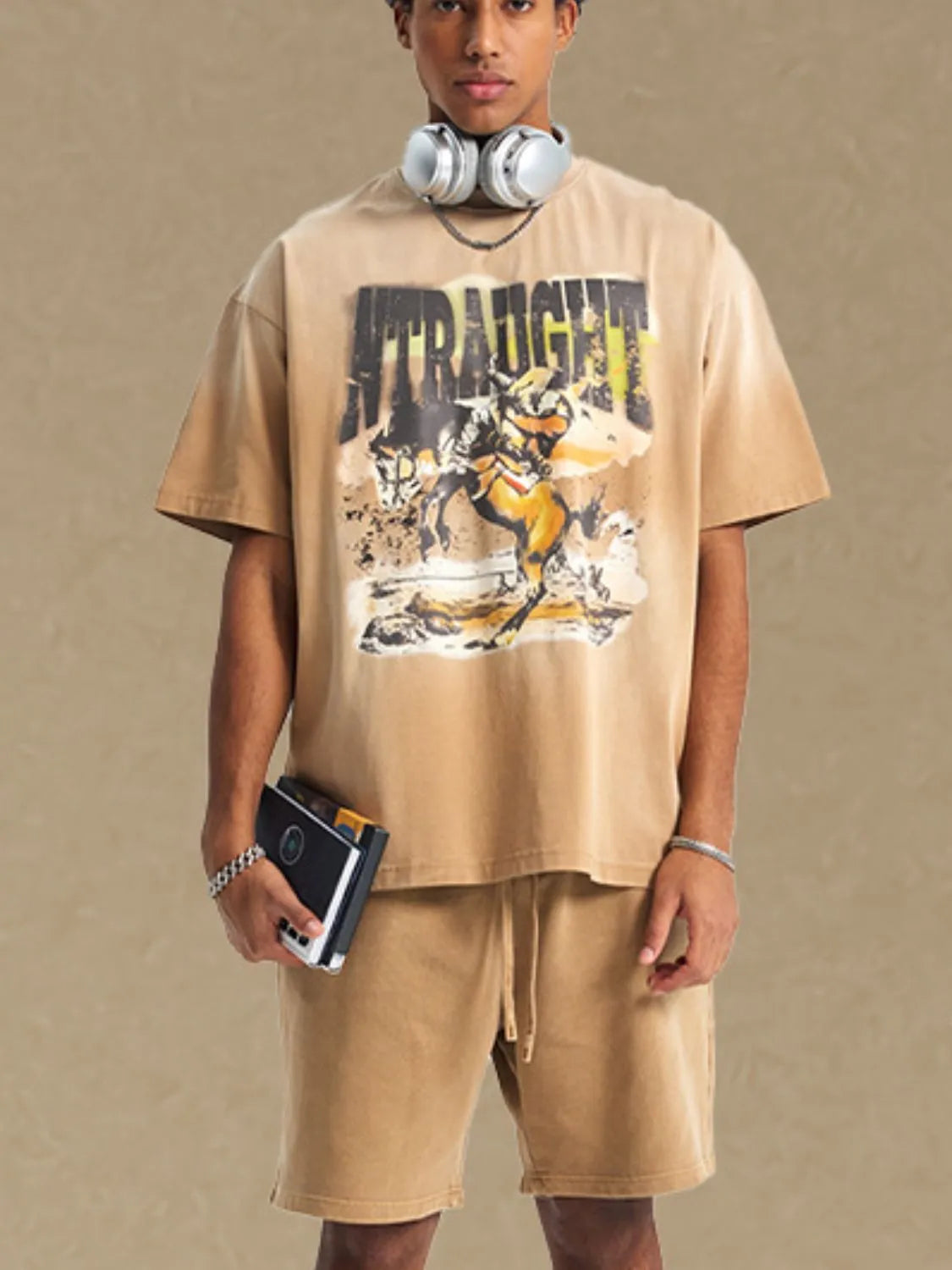NEWYORKLISTED ATLAS MEN'S COLLECTION: Person wearing a beige t-shirt with a graphic design on a plain background