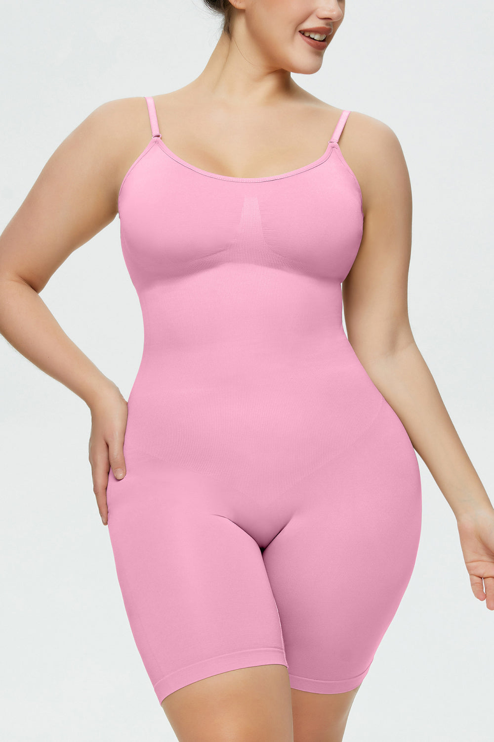 NEWYORKLISTED Intimate Apparel Collection: Person wearing a pink bodysuit against a plain background
