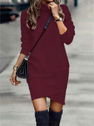 NEWYORKLISTED Style Collection: Woman wearing a burgundy dress with a black handbag on a blurred street background