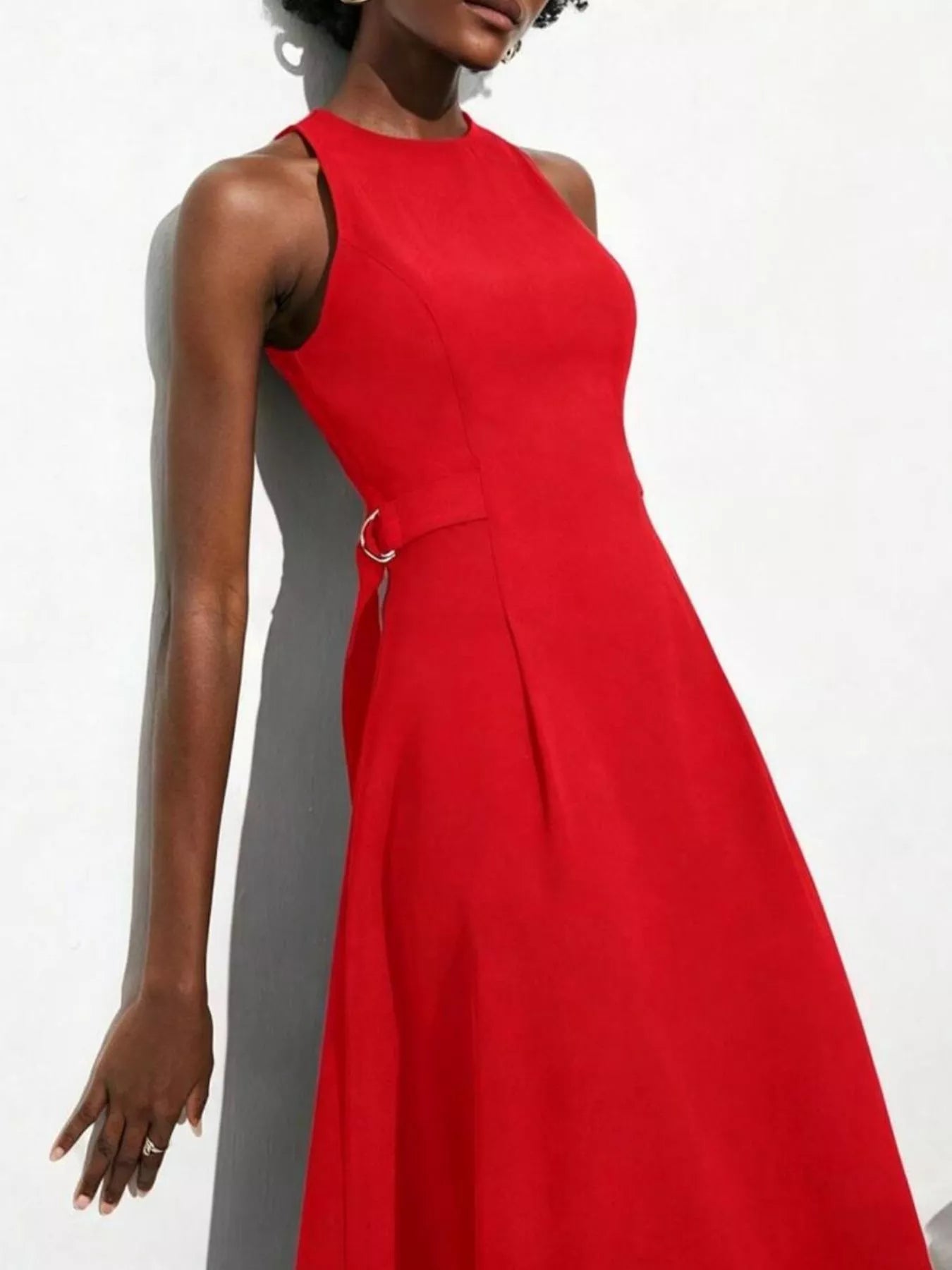 NEWYORKLISTED STYLE COLLECTION: Red dress worn by a model against a white background
