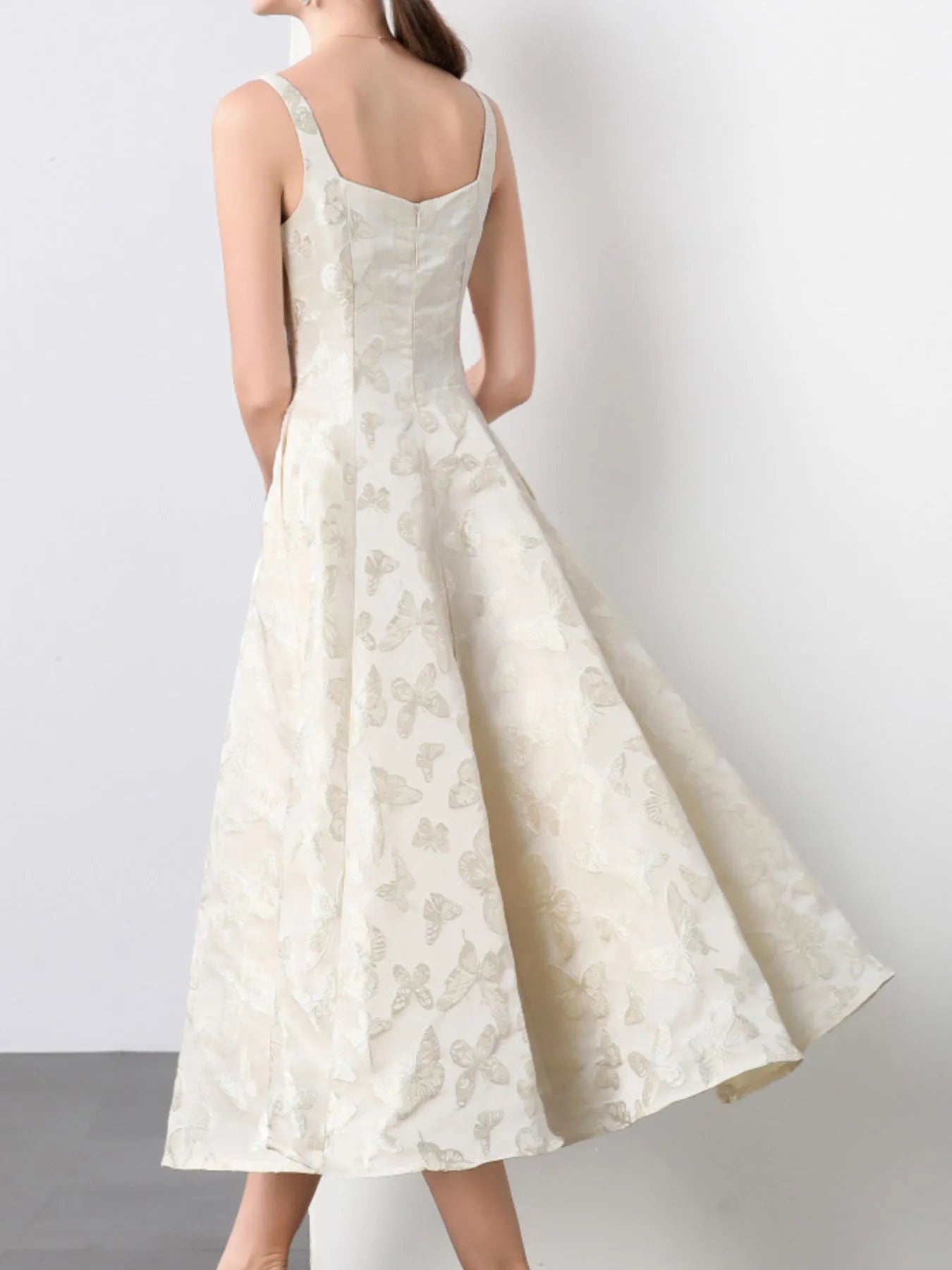 NEWYORKLISTED STYLE COLLECTION: White lace dress on a plain background