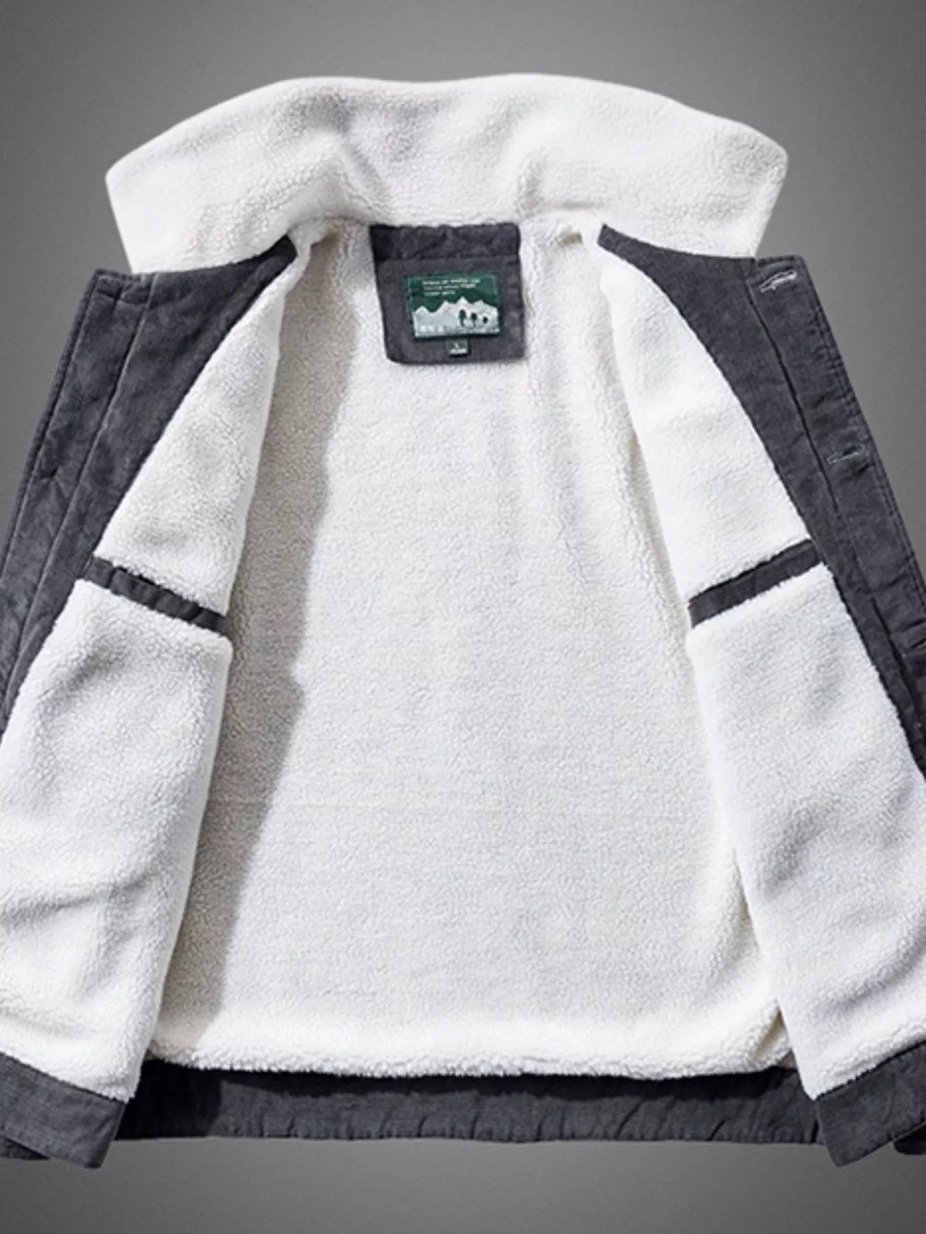 NEWYORKLISTED ATLAS MEN'S COLLECTION: White fleece jacket with gray accents on a gray background