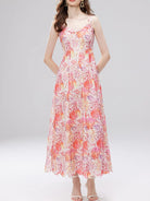 NEWYORKLISTED STYLE COLLECTION: Woman wearing a floral dress on a white background