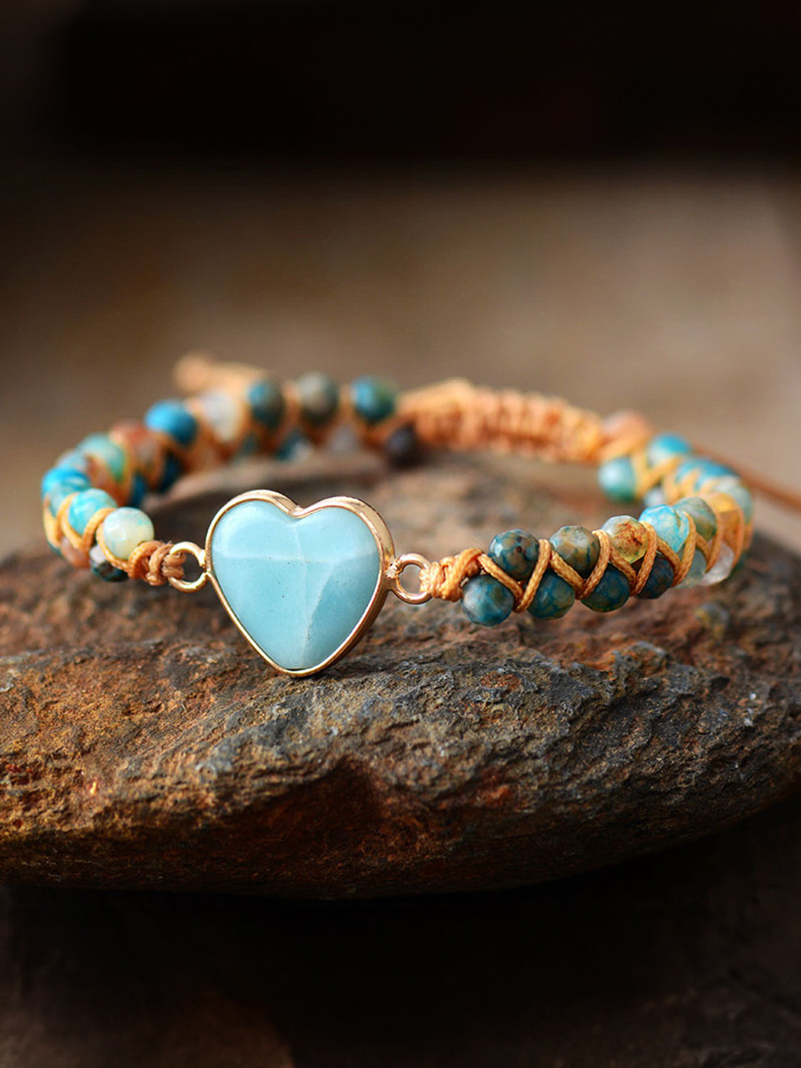 NEWYORKLISTED Valentine’s Day Specials: Bracelet with heart-shaped turquoise charm on a stone surface