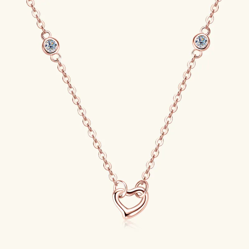 NEWYORKLISTED Valentine’s Day Specials: Rose gold necklace with a heart-shaped pendant on a white background