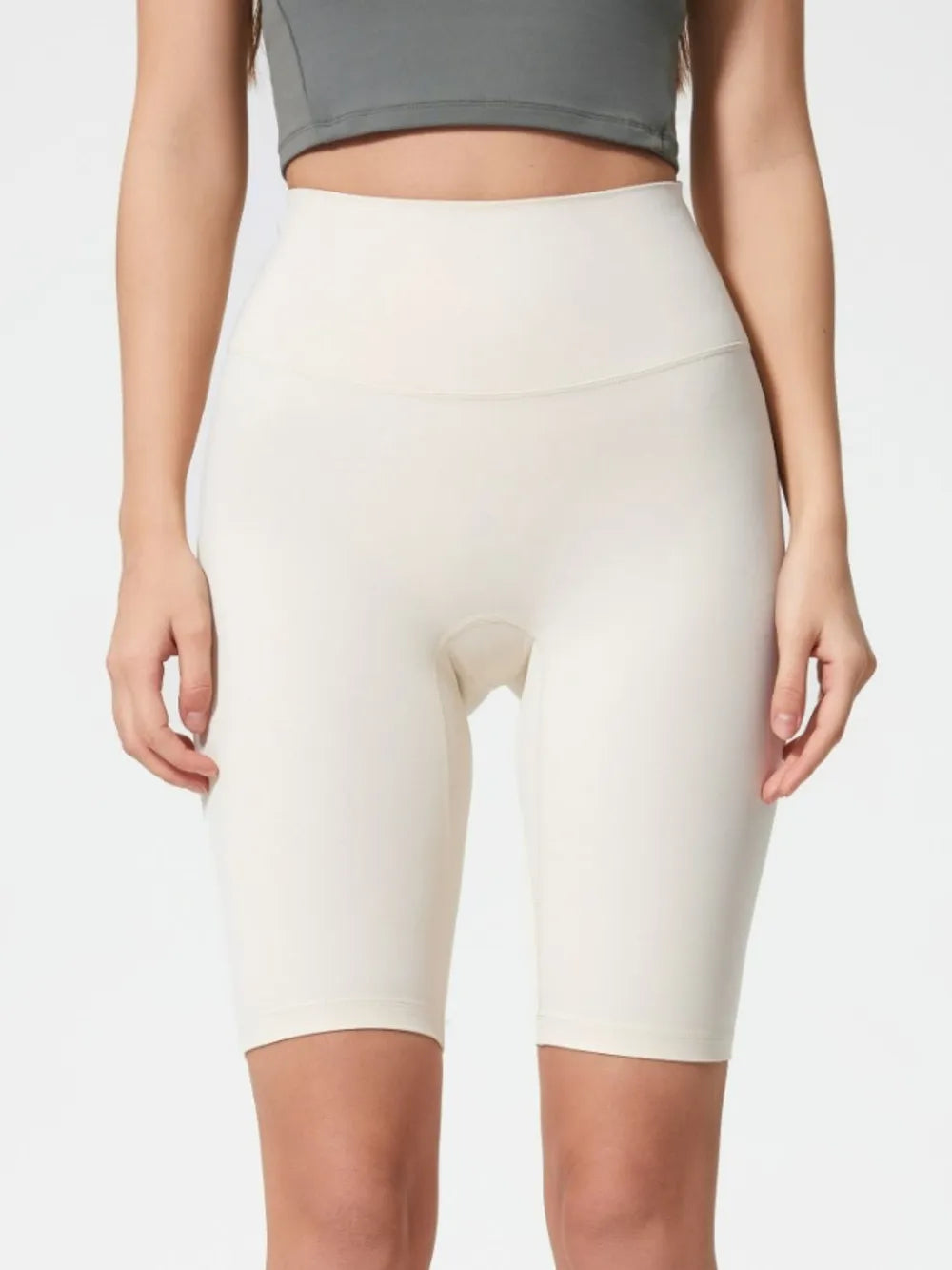 NEWYORKLISTED ACTIVEWEAR COLLECTION: Person wearing white athletic shorts on a plain background