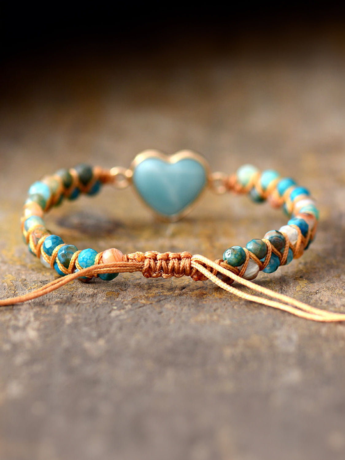 NEWYORKLISTED Valentine’s Day Specials: Bracelet with turquoise heart charm on a textured surface