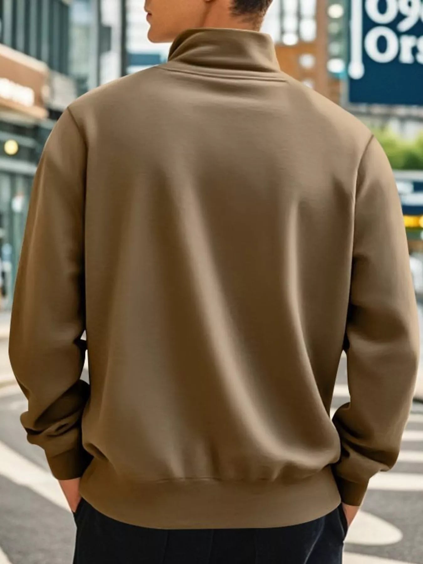 NEWYORKLISTED ATLAS MEN'S COLLECTION: Person wearing a brown jacket on a city street
