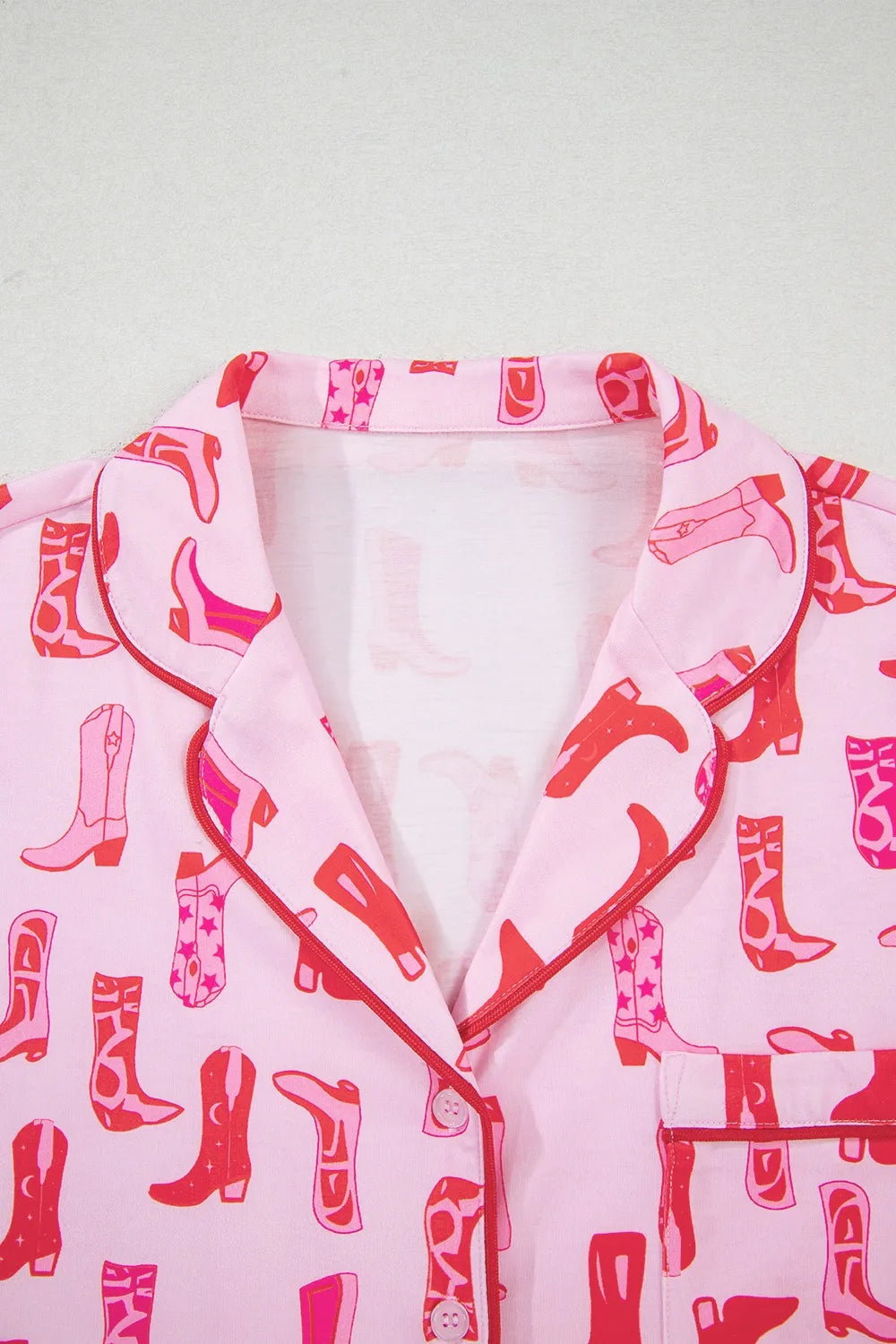 NEWYORKLISTED Intimate Apparel: Pink robe with red cowboy boot pattern on a white background