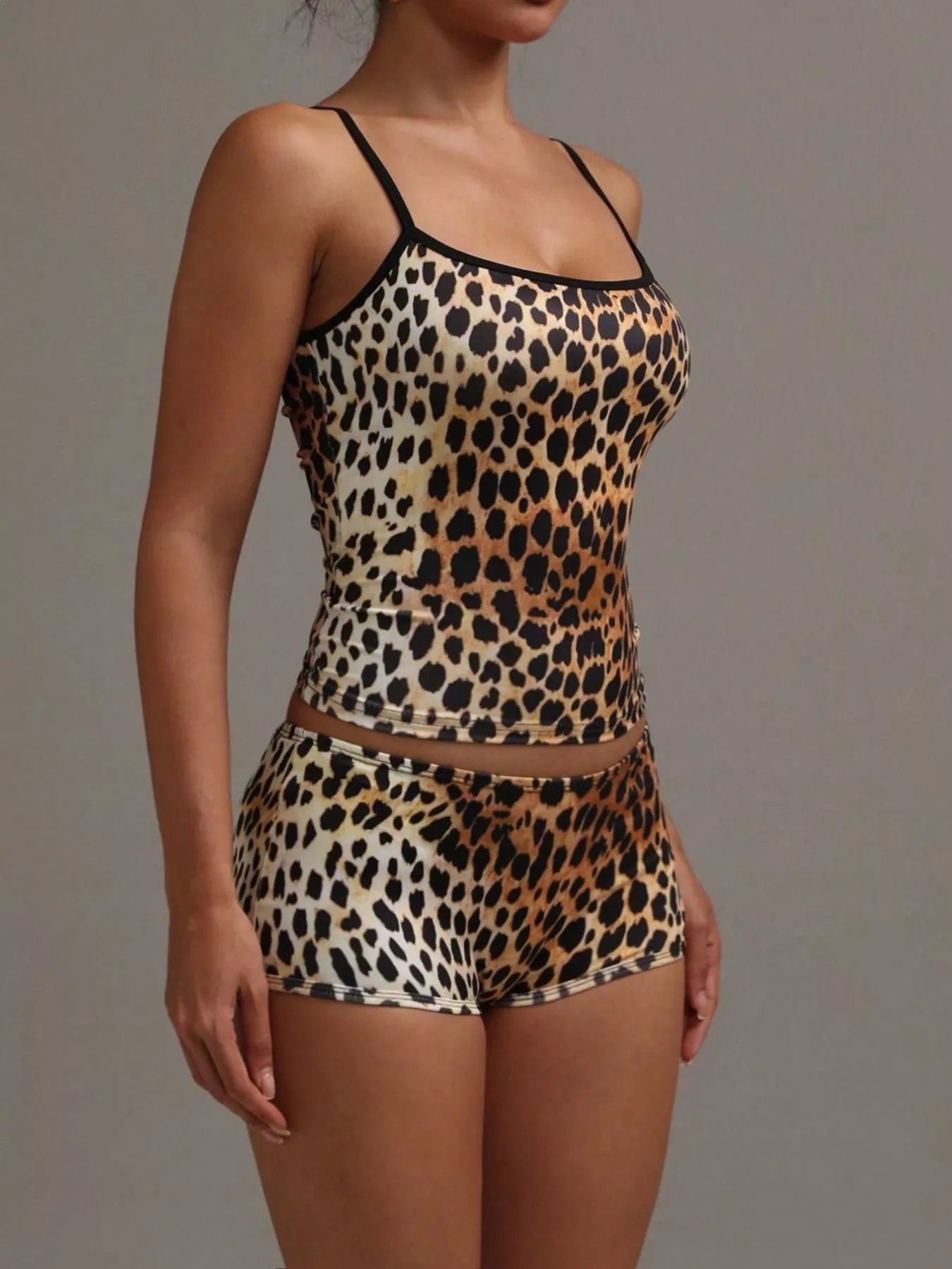 NEWYORKLISTED INTIMATE APPAREL COLLECTION: Leopard print lingerie set on a plain background