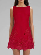 NEWYORKLISTED STYLE COLLECTION: Red dress with floral details on a gray background