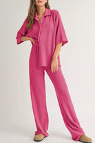 NEWYORKLISTED Comfort Collection: Woman wearing a pink checkered outfit on a white background