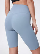 Light blue athletic shorts worn by a person on a plain background