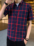 NEWYORKLISTED ATLAS MEN'S COLLECTION: Person wearing a red and blue plaid shirt indoors.