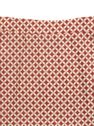 NEWYORKLISTED STYLE COLLECTION: Fabric with a geometric pattern on a red background