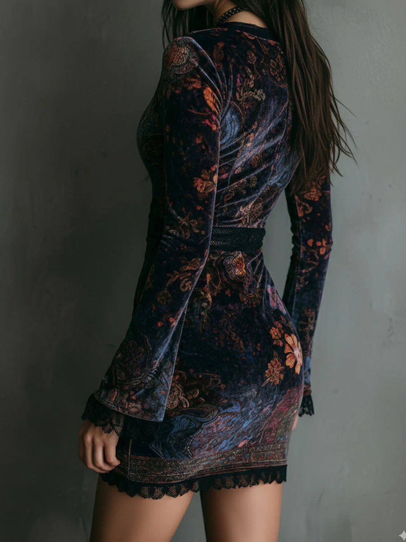 NEWYORKLISTED STYLE COLLECTION: Woman wearing a floral patterned dress against a plain background