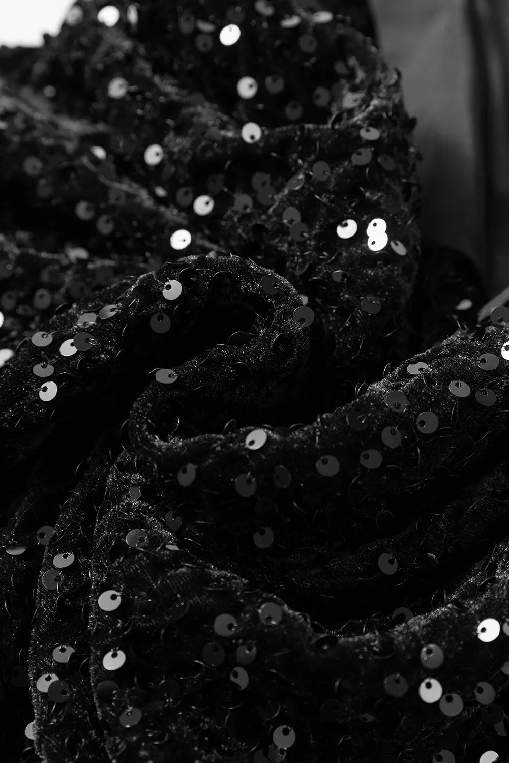 NEWYORKLISTED Valentine's Day Specials: Close-up of black sequined fabric with a blurred background