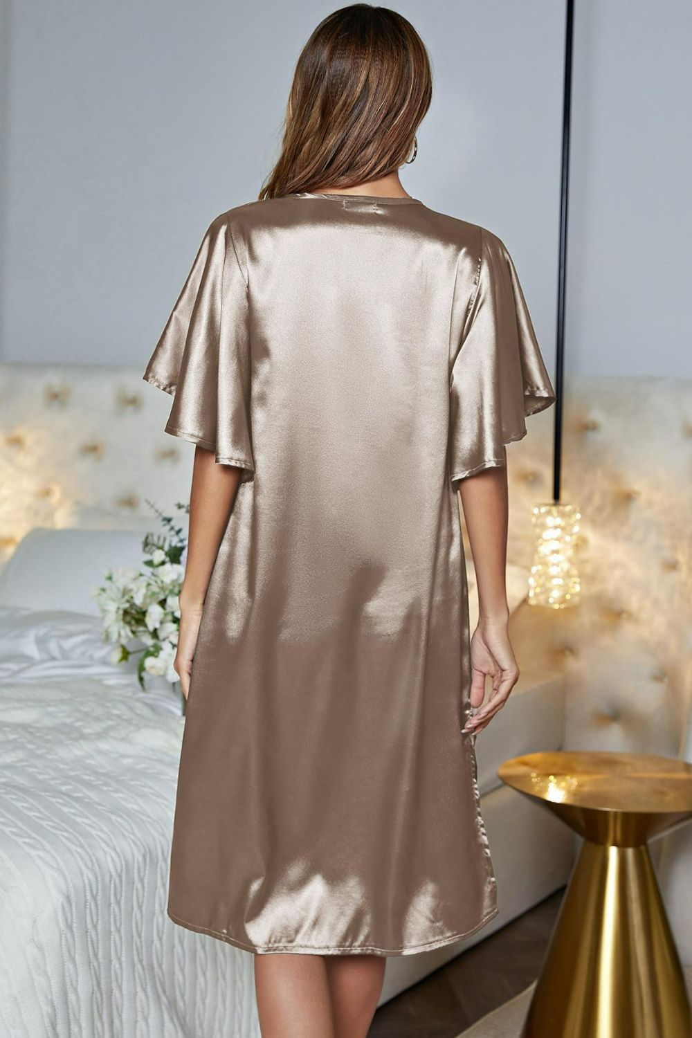 NEWYORKLISTED Intimate Apparel: Woman wearing a satin nightgown in a bedroom setting