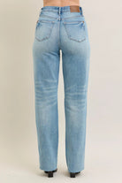 NEWYORKLISTED STYLE COLLECTION: Light blue jeans on a beige background