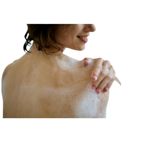 Person with soap suds on their shoulders against a white background