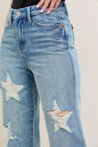 NEWYORKLISTED STYLE COLLECTION: Blue jeans with star designs on a plain background