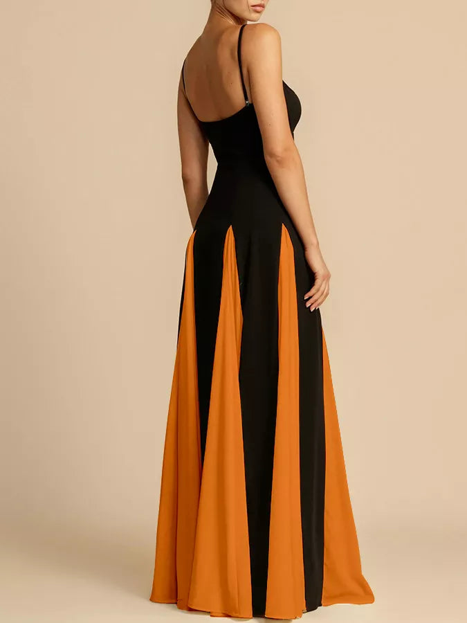 NEWYORKLISTED STYLE COLLECTION: Black and orange dress with a slit on a beige background