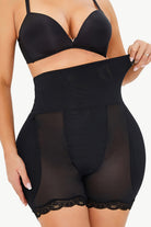 NEWYORKLISTED Intimate Apparel: Black shapewear garment worn by a model on a white background