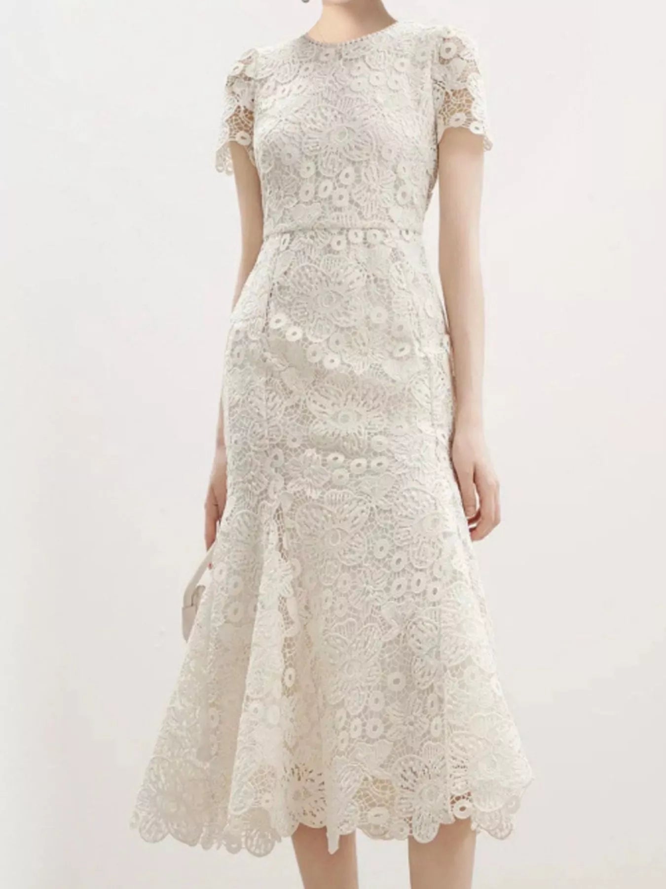 NEWYORKLISTED STYLE COLLECTION: White lace dress on a white background