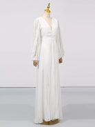 NEWYORKLISTED STYLE COLLECTION: White dress on a mannequin against a plain background