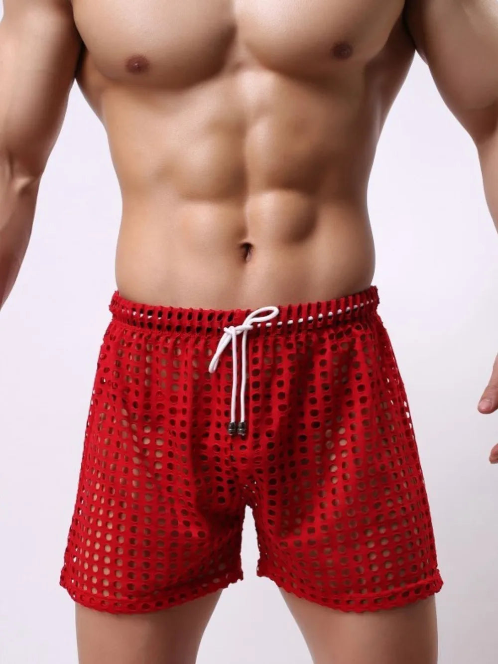 NEWYORKLISTED ATLAS MEN'S COLLECTION: Red swim shorts worn by a person on a plain background