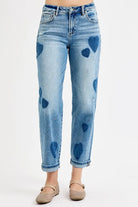 Light wash mid-rise boyfriend jeans with subtle heart print, rolled cuffs, and relaxed fit — NEWYORKLISTED STYLE COLLECTION.