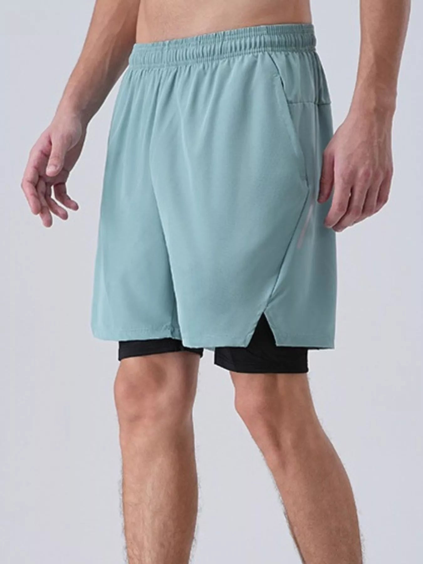 NEWYORKLISTED ATLAS MEN's COLLECTION: Men's Elastic Waist Active Shorts Light blue athletic shorts worn by a person on a plain background