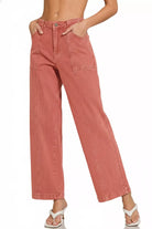 NEWYORKLISTED Style Collection: Pink jeans worn by a person on a white background
