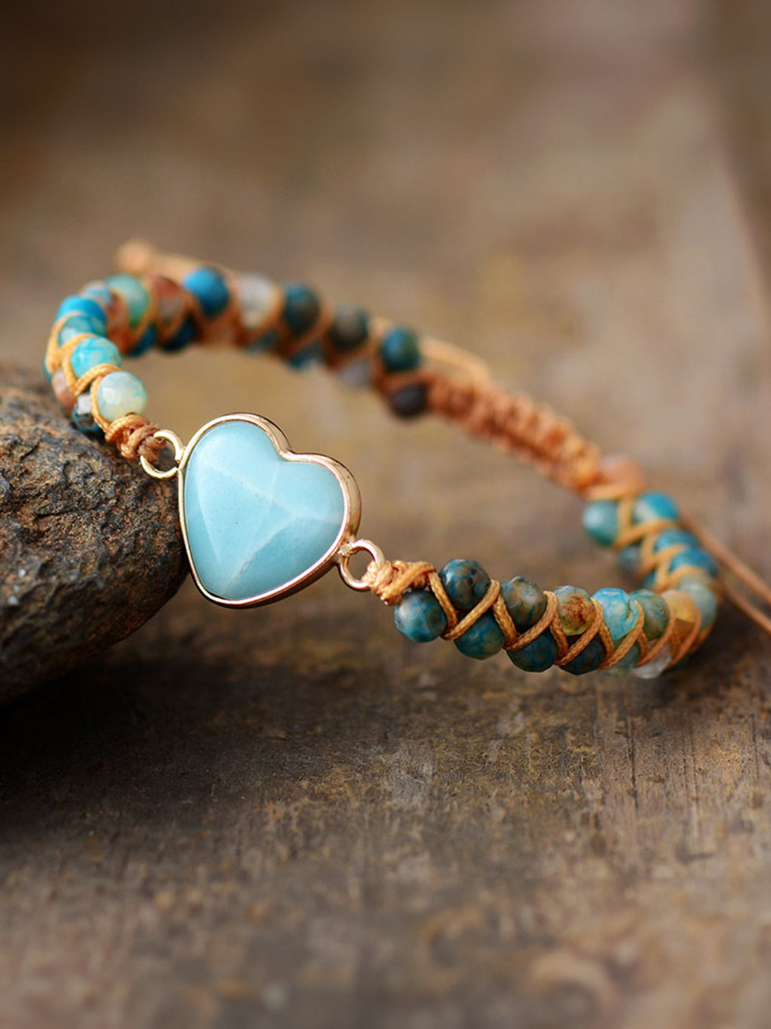 NEWYORKLISTED Valentine’s Day Specials: Bracelet with heart-shaped turquoise stone on a wooden surface