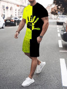 NEWYORKLISTED ATLAS MEN's COLLECTION: Person wearing a black, yellow, and green outfit with a unique design on a street.