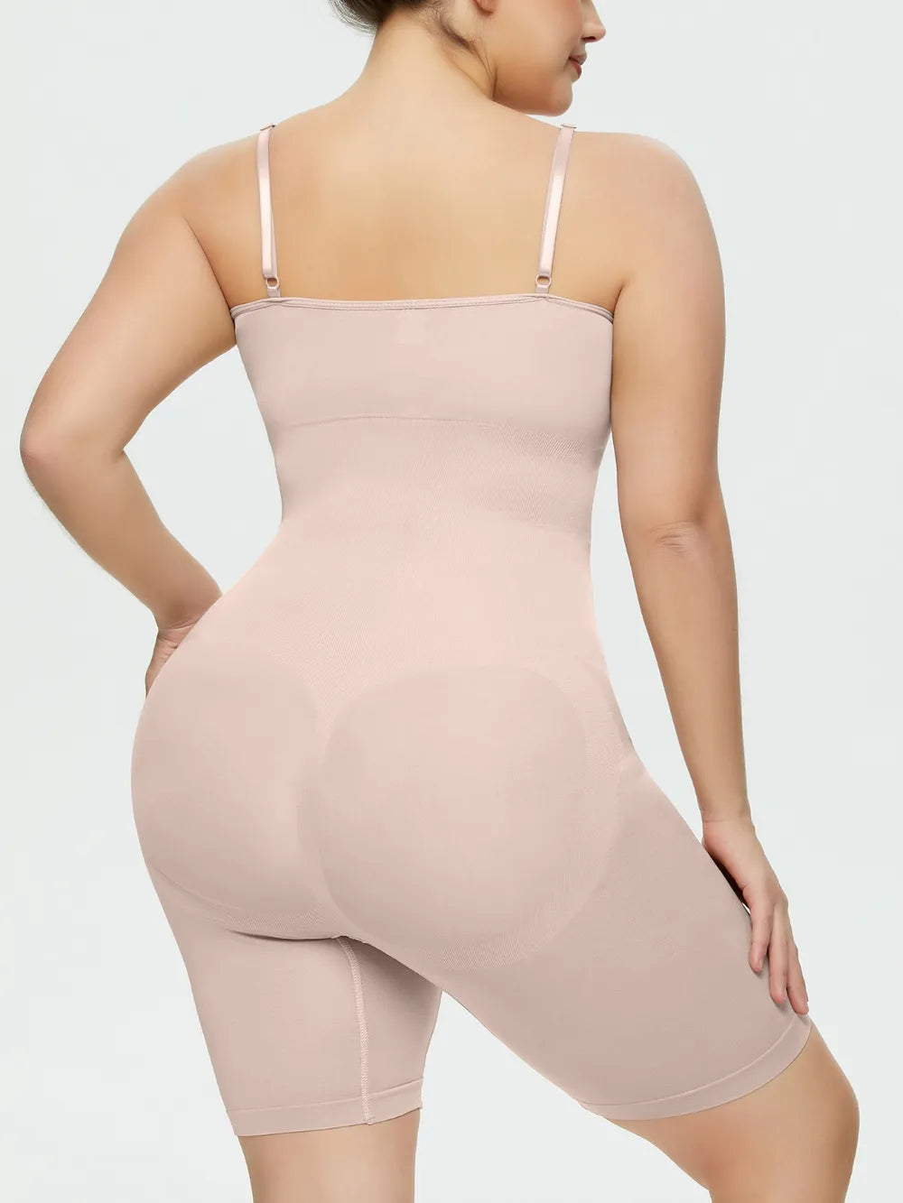 NEWYORKLISTED Intimate Apparel Collection: Person wearing a beige shapewear garment on a plain background