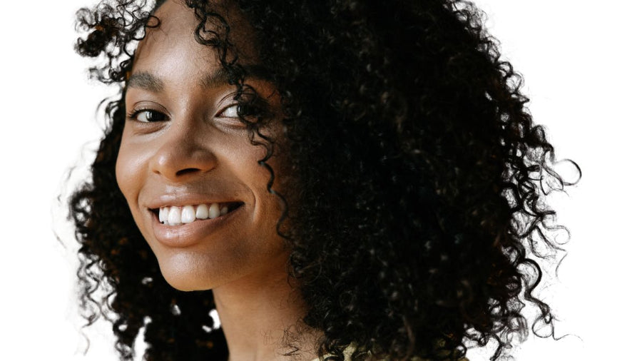 AMLA NATURALS: African American Model wearing natural curls promoting AMLA NATURALS Hair care 