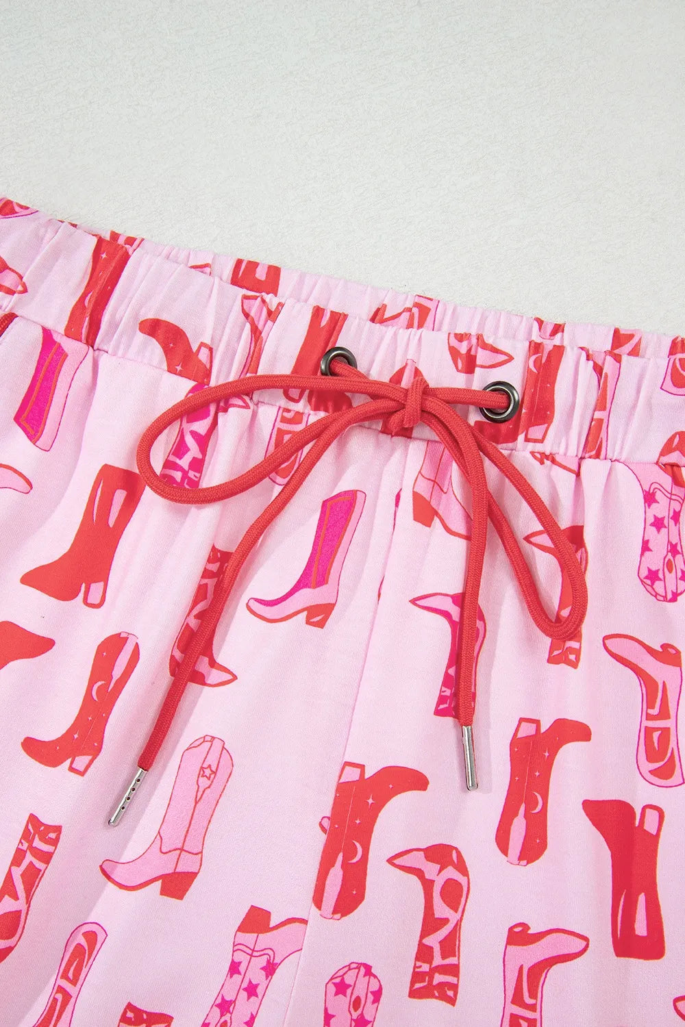 NEWYORKLISTED Intimate Apparel: Skirt with pink cowboy boot pattern on a white background