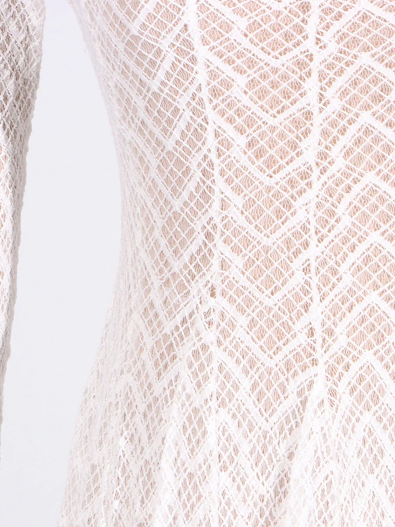 NEWYORKLISTED STYLE COLLECTION: Close-up of a textured beige fabric with a diamond pattern on a white background