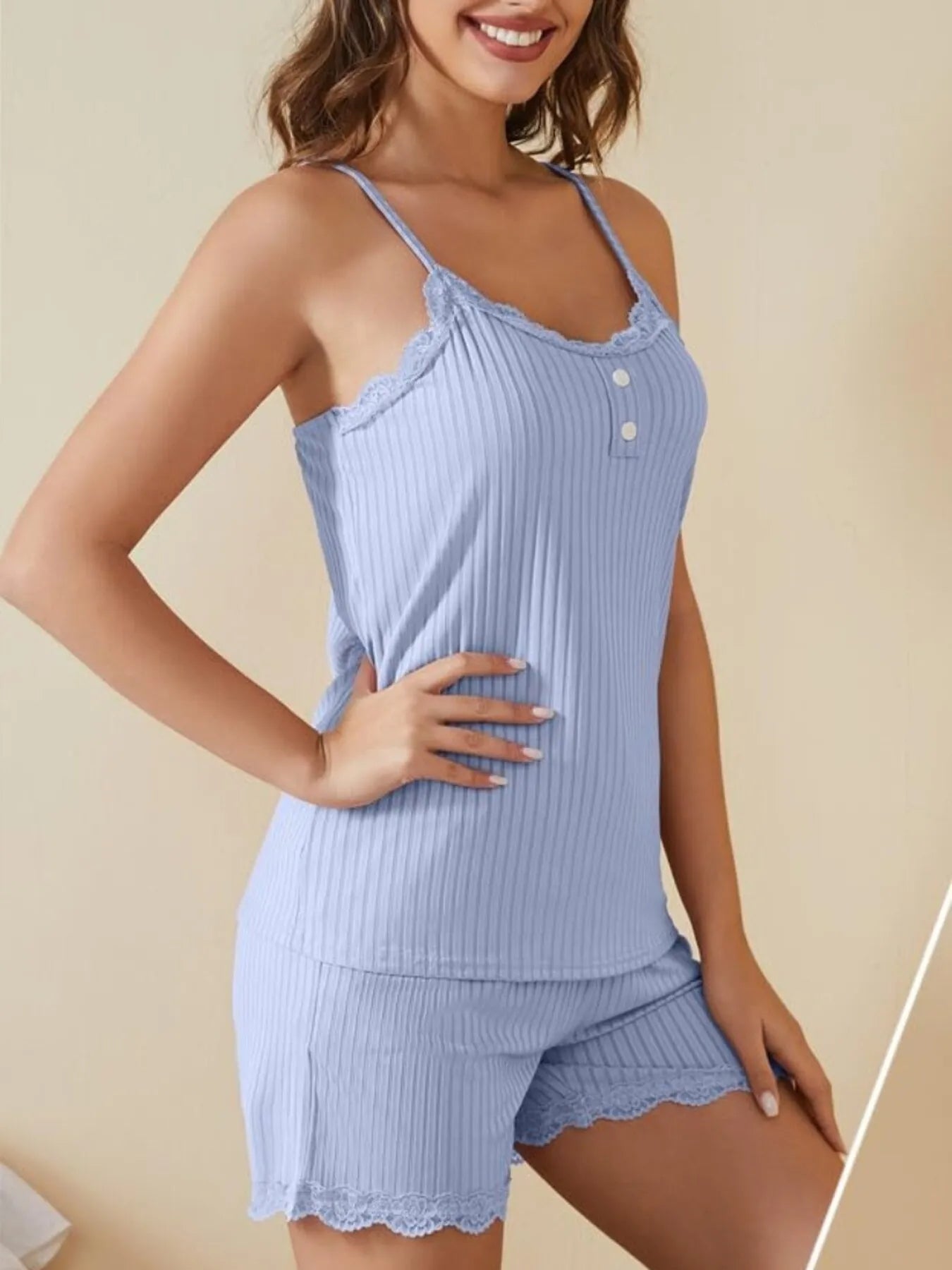 NEWYORKLISTED Intimate Apparel: Woman wearing a light blue ribbed pajama set on a beige background