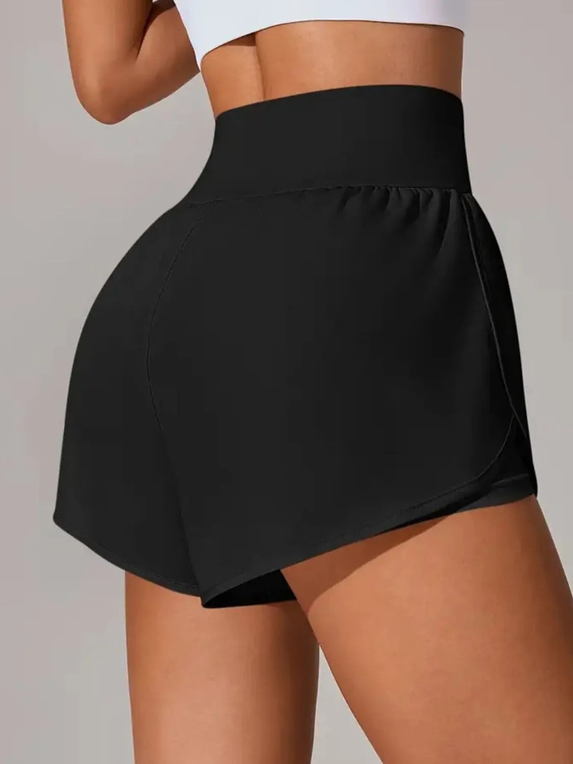 NEWYORKLISTED Activewear: Black athletic shorts worn by a person on a plain background
