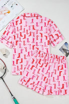 NEWYORKLISTED Intimate Apparel: Pink pajama set with red sock pattern on a white surface