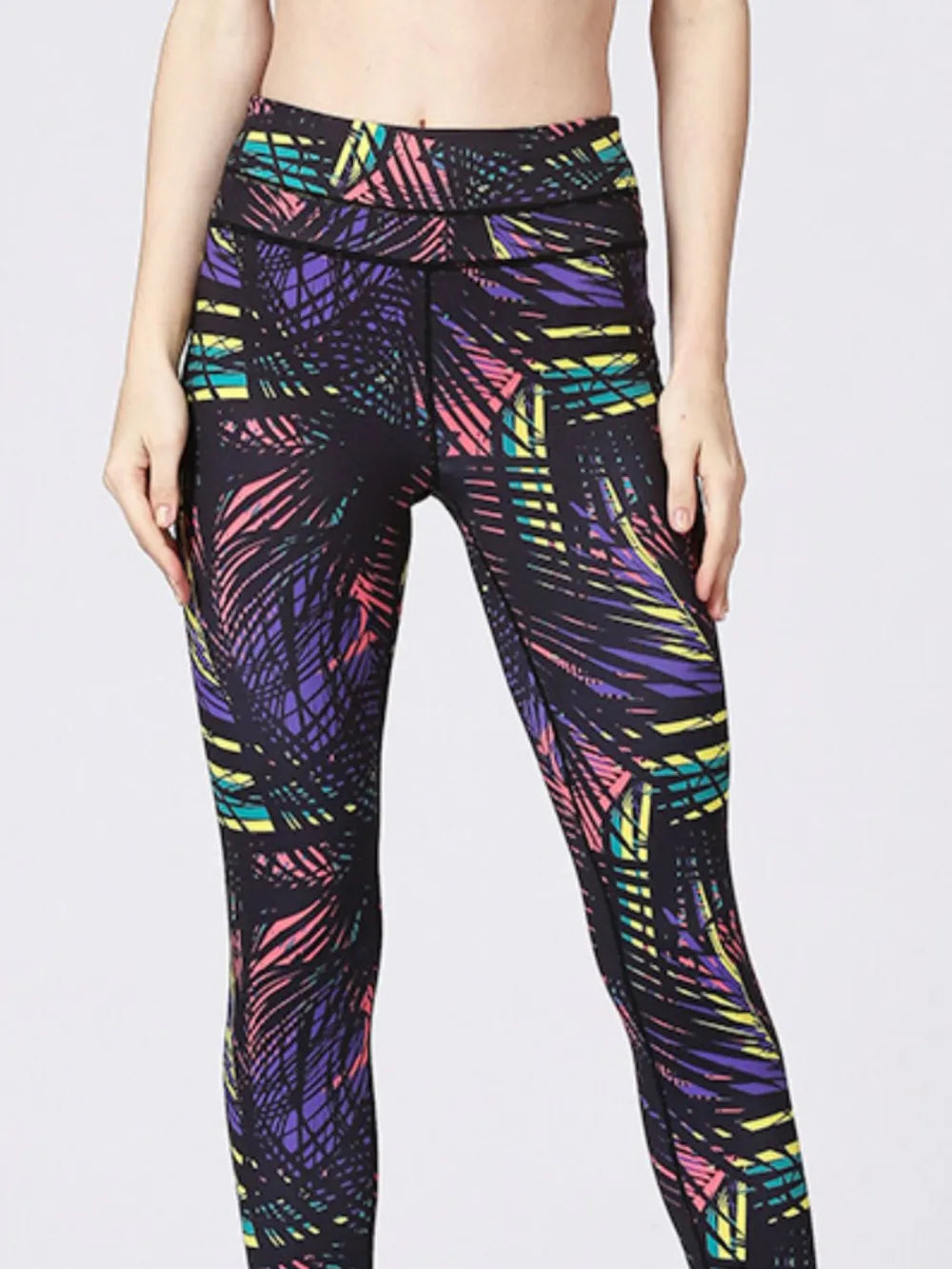 NEWYORKLISTED ACTIVEWEAR COLLECTION: Multicolored patterned leggings on a plain background