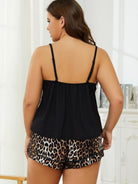 NEWYORKLISTED Intimate Apparel: Woman wearing a black top and leopard print shorts in a room with white walls and a white dresser.