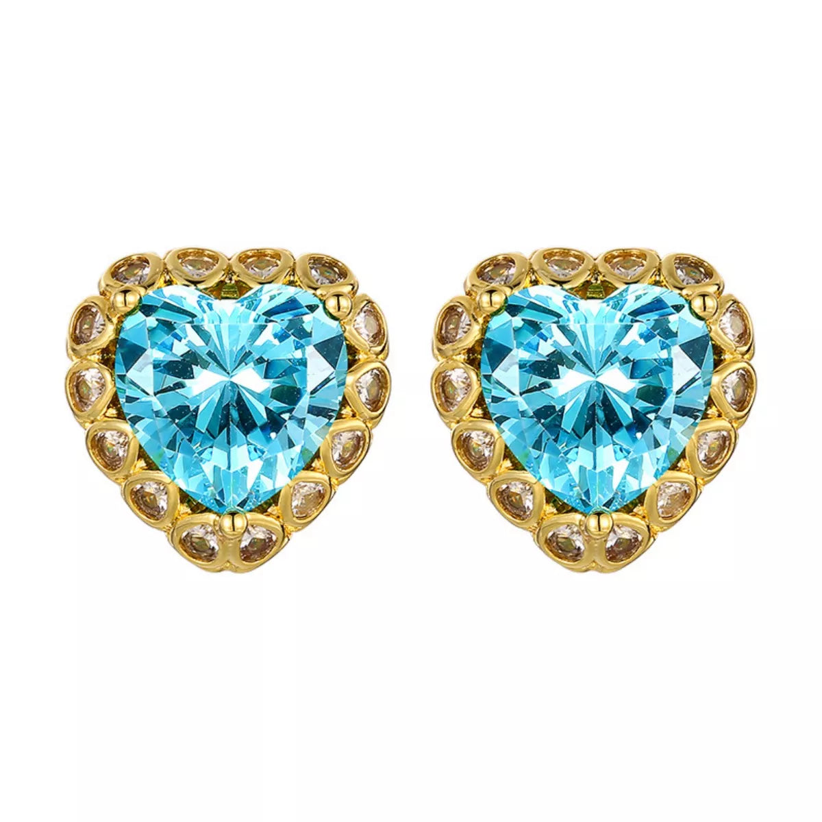NYLD Glamour Collection by NEWYORKLISTED: Heart-shaped blue gemstone earrings with gold accents on a white background