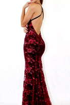 Red sequin evening gown with a backless design on a white background