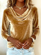 NEWYORKLISTED STYLE COLLECTION: Person wearing a brown velvet top with a plain background
