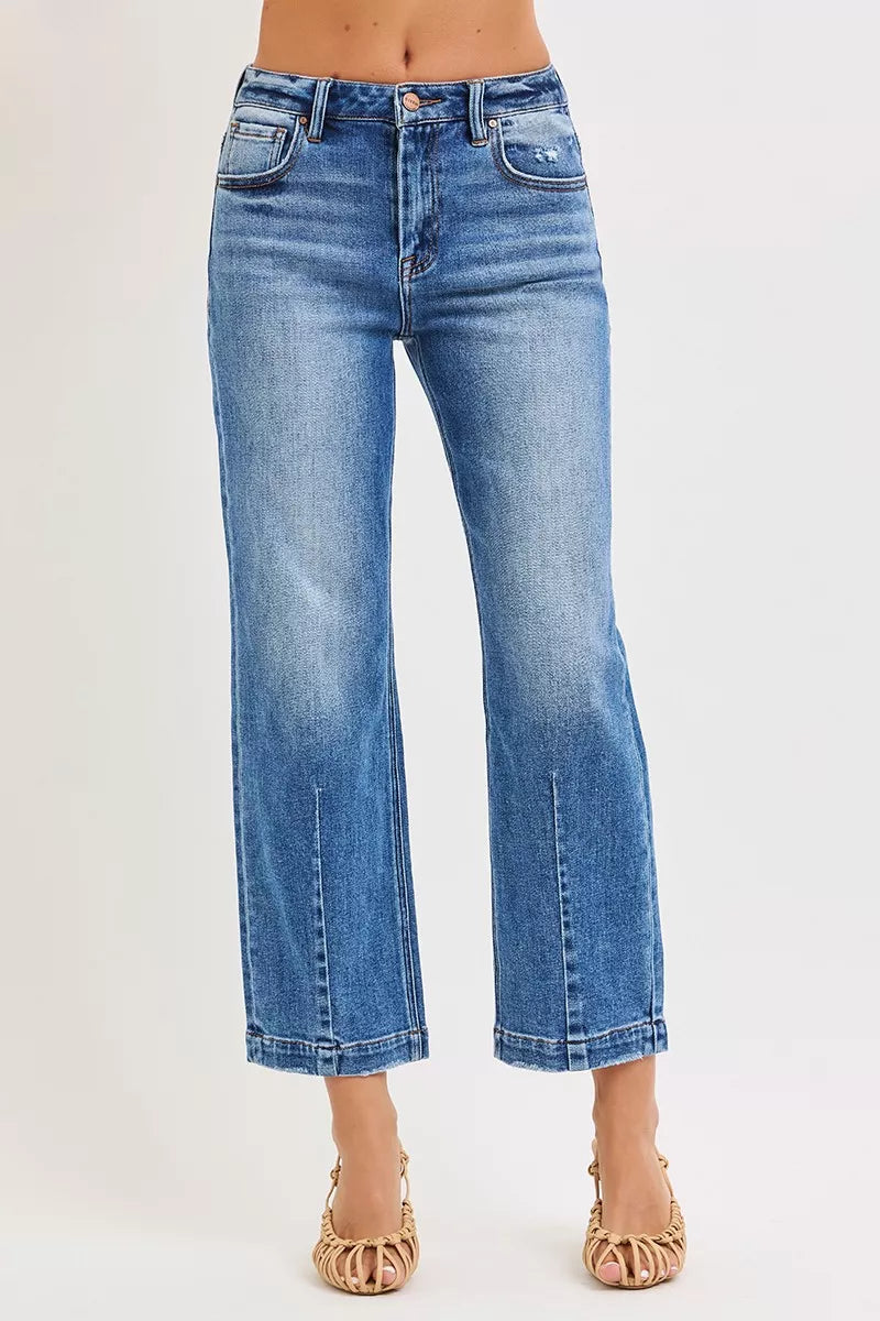 NEWYORKLISTED DENIM COLLECTION: Blue jeans worn by a person on a white background