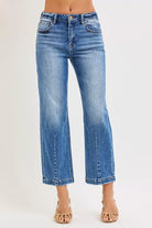 NEWYORKLISTED DENIM COLLECTION: Blue jeans worn by a person on a white background