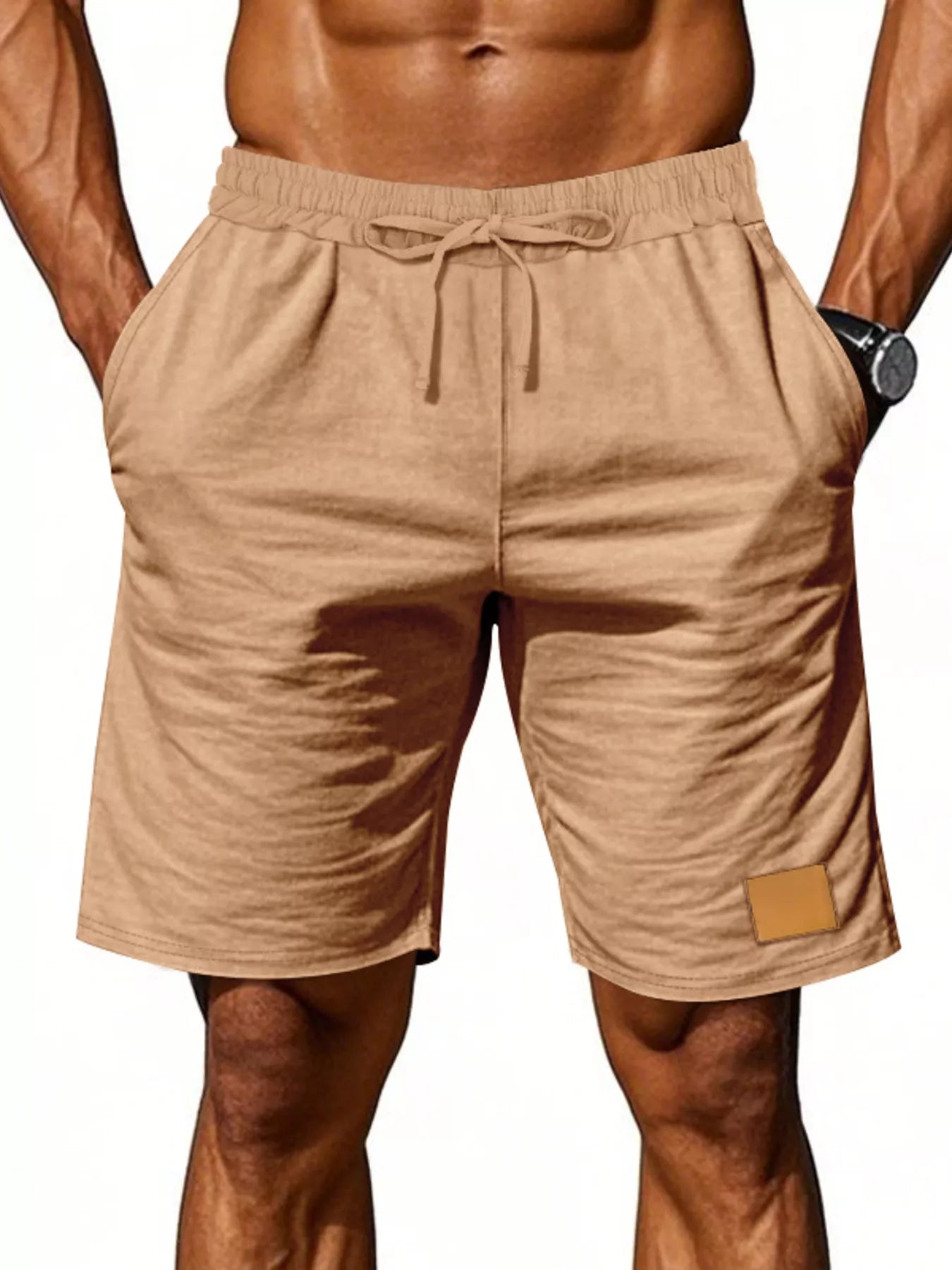 NEWYORKLISTED ATLAS MEN'S COLLECTION: Beige shorts worn by a person on a white background